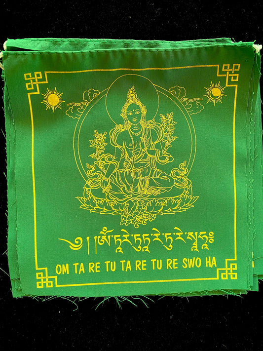 High-quality Tibetan prayer flags: Close-up of 1 Green Tara flag from a set of 10, 8x8 inches each, colored green, imprinted with her image in yellow ink.
