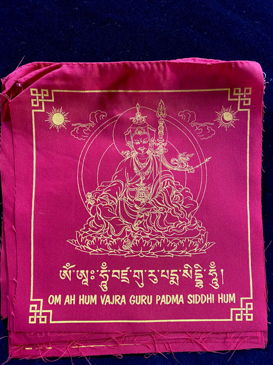 High-quality Tibetan prayer flags: Close-up of 1 Guru Rinpoche flag from a set of 10, 8x8 inches each, colored red, imprinted with his image in yellow ink.