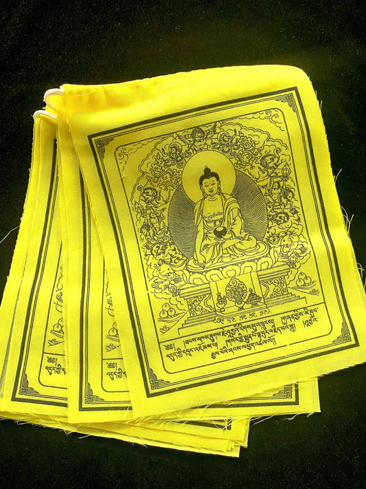 A stunning arrangement of 10 all-yellow Buddha Shakyamuni Prayer flags, each measuring 6&quot;x7.5&quot;, set against a black background.