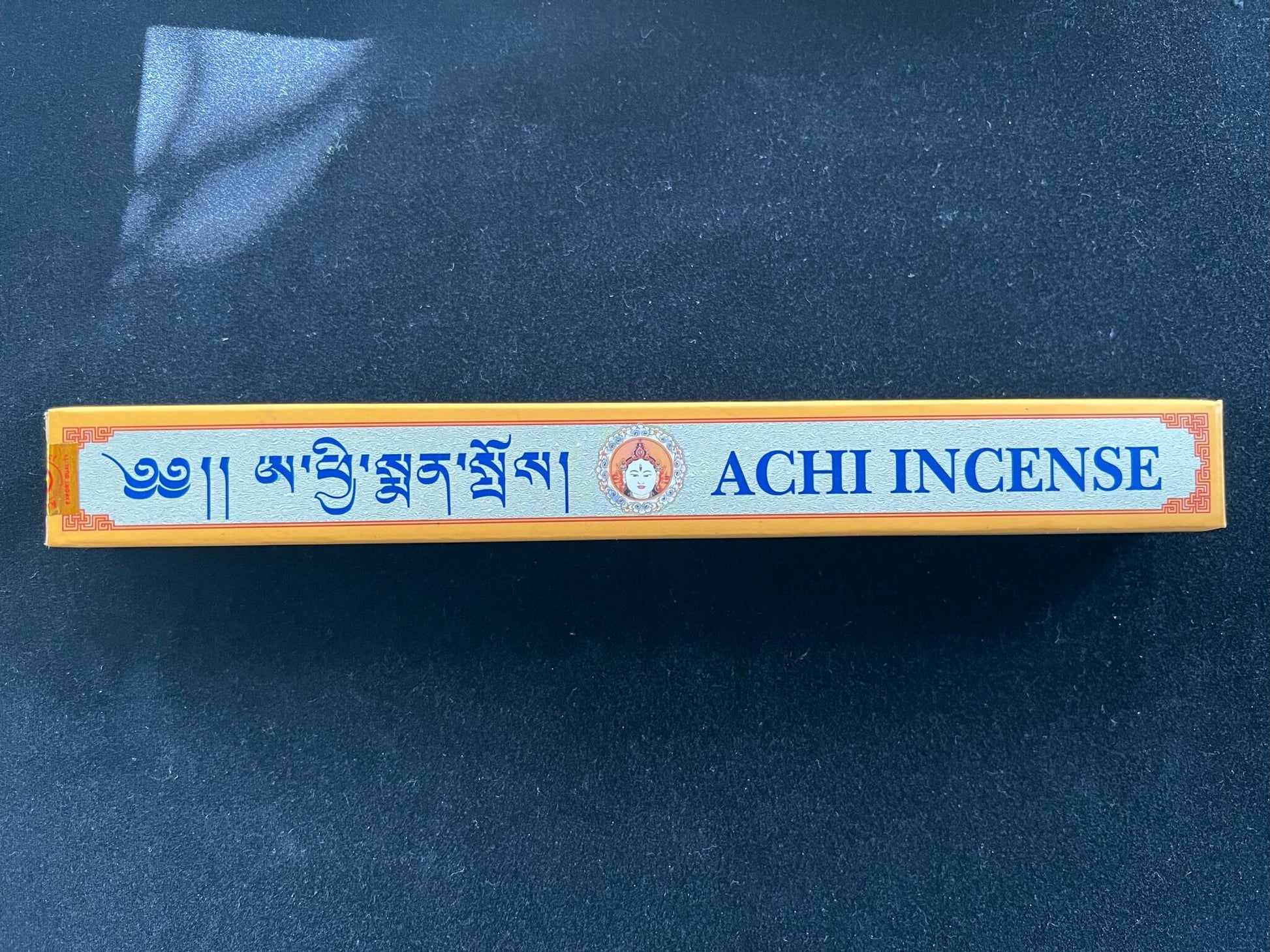 Achi Incense box on black velvet. Try our specialty incense for an enhanced meditation experience.