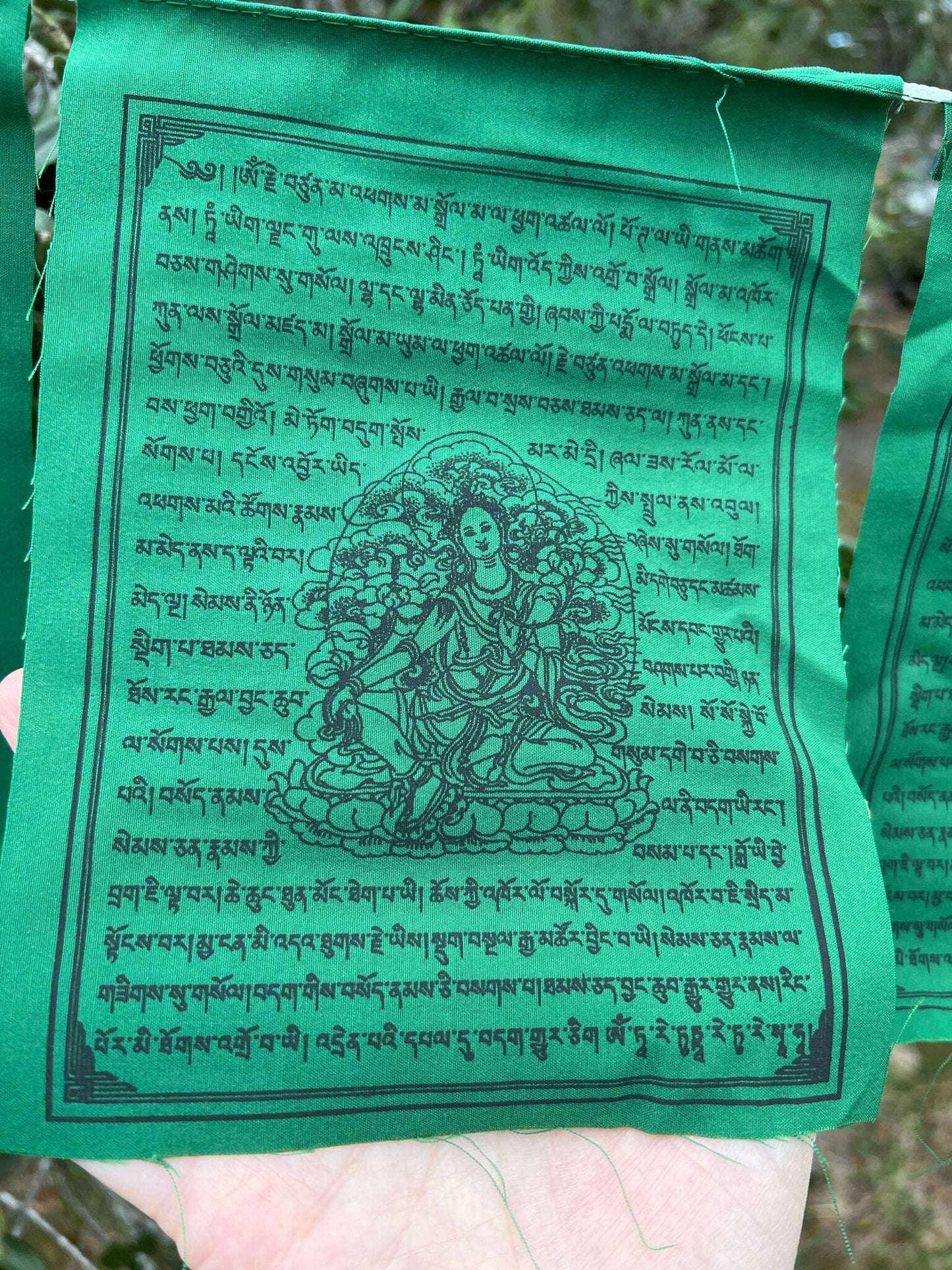 Set single Green Tara flag from a 10-flag strand. High-quality Tibetan prayer flags, 6x7.5&quot;, black ink, for indoor/outdoor use