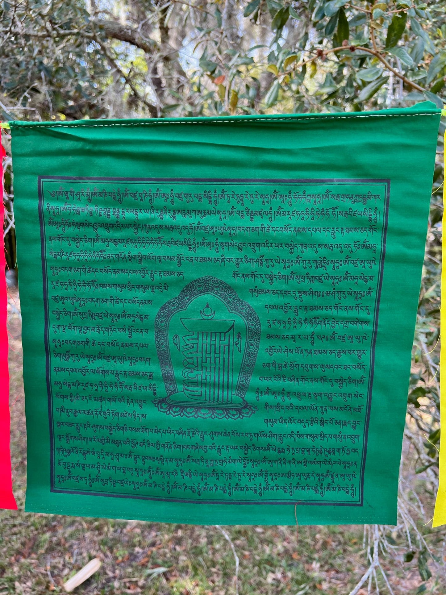 Shimmering green Kalachakra prayer flag, 13&quot;x13&quot; from a 25-flag strand. 5 colors, imprinted with prayers & 10-fold seed syllable.