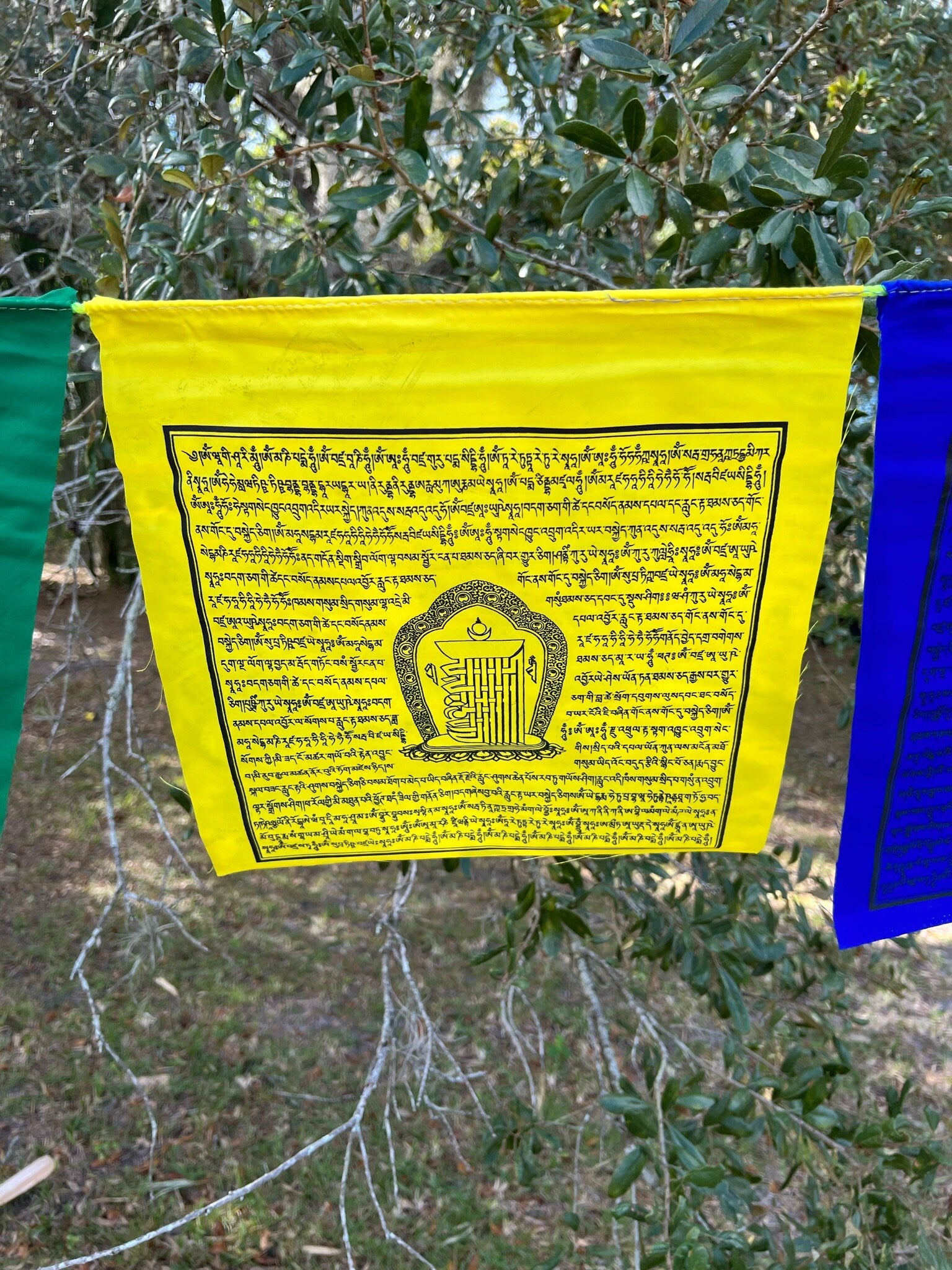 Shimmering yellow Kalachakra prayer flag, 13&quot;x13&quot; from a 25-flag strand. 5 colors, imprinted with prayers & 10-fold seed syllable.