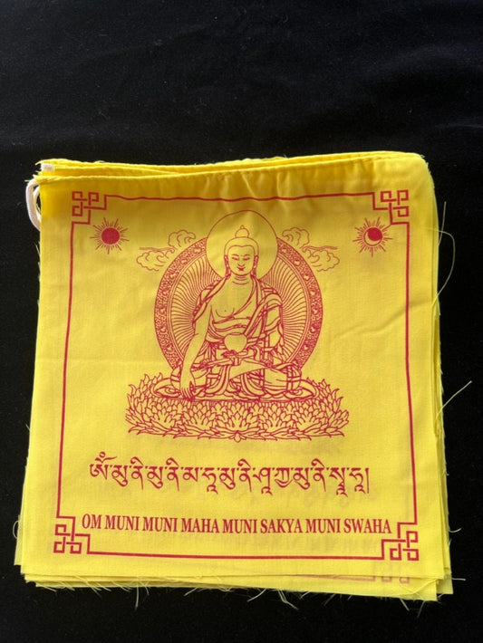 a beautiful close up of an all yellow 8x8 inch flag of Buddha Shakyamuni printed in red on a black background.