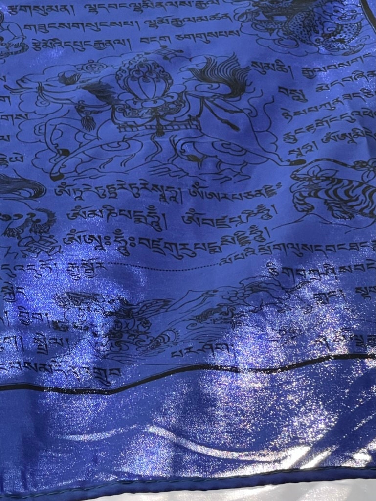 A stunning blue section of a vertical Tibetan prayer flag banner, featuring deity images in 5 colors on 5 streamers. 28x81 inches, designed for pole hanging.