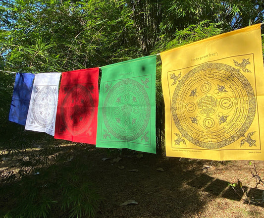 &quot;A beautiful outdoor display of a segment from our 25-flag  set of Tashi Gyaltsen or Auspicious Victory Banner Mandala, featuring vibrant five colors.